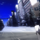 Okabe standing on a city street with tall buildings and a blue sky.
